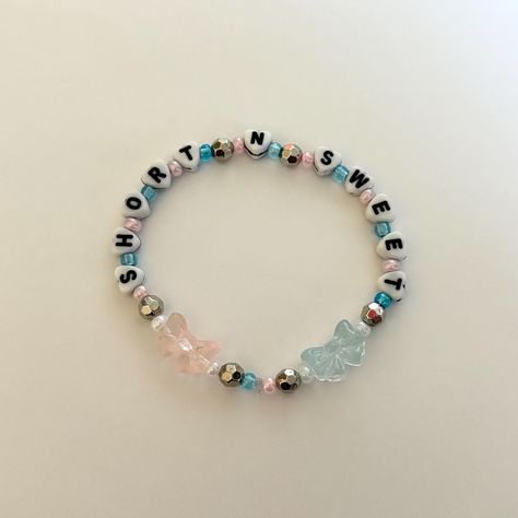 Handmade beaded friendship bracelets. All bracelets are made with stretchy, clear string. Short N Sweet Bracelet, Sabrina Carpenter Bracelet Ideas, Sabrina Carpenter Friendship Bracelet, Sabrina Carpenter Bracelets, Beaded Friendship Bracelets, Bracelet Business, Business Things, Bracelet Inspiration, Friendship Bracelets With Beads