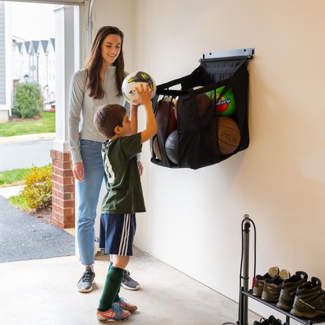 Ball Storage Rack | Wall Mount Kayak Storage Garage, Garage Storage Inspiration, Kayak Storage, Ball Holder, Ceiling Storage, Ball Storage, Boat Storage, Storage Closet, Sports Organization