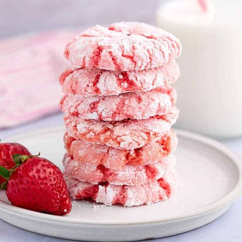 You'll love these strawberry crinkle cookies made with cake mix and butter. Learn secret tricks to keep the powdered sugar from dissolving! Cake Mix Strawberry Cookies, Strawberry Crinkle Cookies Cake Mixes, Cakebox Cookies Strawberry, Great American Cookie Strawberry Crinkle, Strawberry Cake Mix Cookie Recipes, Strawberry Cake Mix Cookies, Strawberry Pudding, Crinkle Cookies Recipe, Pink Cookies