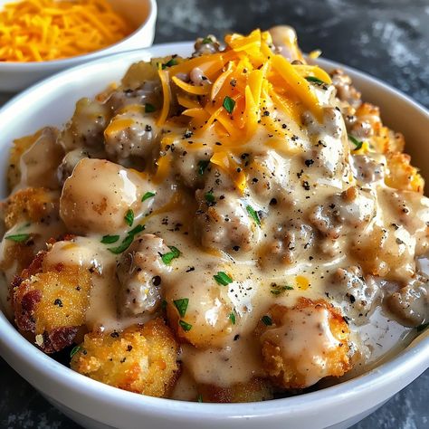 🍳🥓 Start your morning with a Tater Tot Breakfast Bowl with Sausage Gravy! #BreakfastBliss Tater Tot Breakfast Bowl with Sausage Gravy Ingredients: Tater tots Sausage, crumbled Flour Milk Salt and pepper Cheddar cheese, shredded Instructions: Bake tater tots until crispy. Cook sausage, stir in flour, then gradually add milk to form gravy. Serve gravy over tater tots with shredded cheese. 🥔🧀 Enjoy a bowl of crispy, creamy goodness. Perfect for weekend brunch or a satisfying weekday breakfast.... Sausage Gravy Tater Tots, Tater Tot Breakfast Bowl With Sausage Gravy, Breakfast Bowls With Potatoes, Ground Sausage Breakfast Recipes, Tater Tot Breakfast Bowl, Soul Breakfast, Brunch Breakfast Ideas, Unique Breakfast Ideas, Tasty Breakfast Recipes