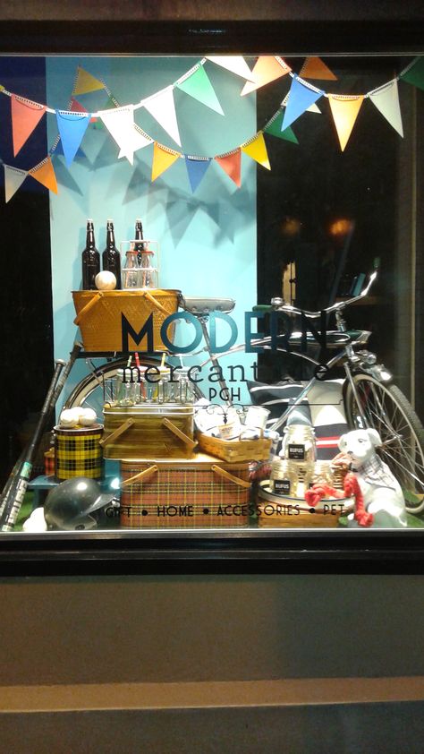 Mid summer picnic window featuring local candles and dog treats with a vintage bicycle. 2015 Picnic Window Display, Camping Window Display, Summer Shop Window Displays, Summer Shop Window, Homeware Display, Spring Window Display, Summer Window Display, Store Front Windows, Window Display Retail