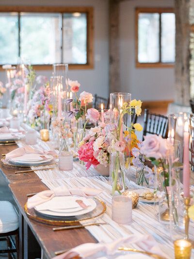 Crystal and Jason Pastel Taper Candles Wedding, Tapered Candles And Bud Vases, Romantic Spring Garden Wedding, Pink And Orange Wedding Table Setting, 30a Elopement, Wedding Long Table Decorations, Coquette Brunch, Pastel Reception, Long Tablescape