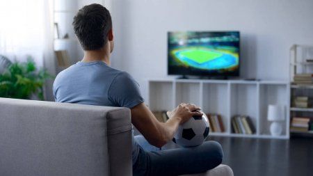 Similar images to 286727894 Excited black guy watching sports on tv at home World Cup Semi Final, Watching Football, Iptv Subscription, Semi Final, Real Estate Buying, Soccer Team, Man Photo, Coming Home, Forex Trading