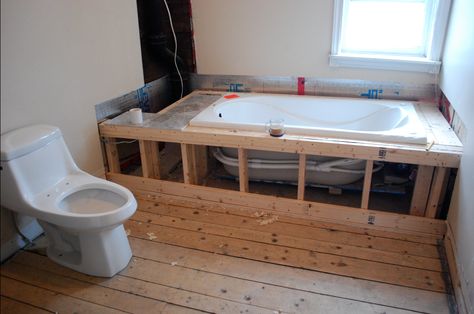 Build a frame around a bathtub, and install tiling for a built-in bathtub.  If you can, try to make a door or some way for easy access if you have to mess with the pipes or drain in the future. Drop In Tub Surround, Drop In Tub Ideas, Tub Surround Ideas, Concrete Bathtub, Bathtub Surround, Built In Bathtub, Diy Bathtub, Drop In Tub, Drop In Bathtub