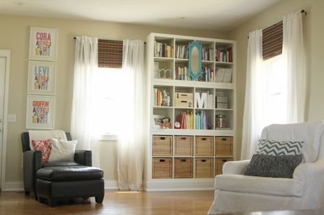 They are three Expedit (ikea) bookshelves stacked on top of each other. The bookshelves are sitting on a base basically built a box for the bookshelves to sit on and trimmed it out with the same quarter round that goes around our baseboard.  I love how they look and it was much more affordable than actual built-ins. @Ben Silbermann Jenkins Diy Built In Shelves, Ikea Bookshelves, Ikea Shelves, Ikea Ideas, Built In Bookcase, Book Case, Built In Shelves, Blog Page, Ikea Hacks