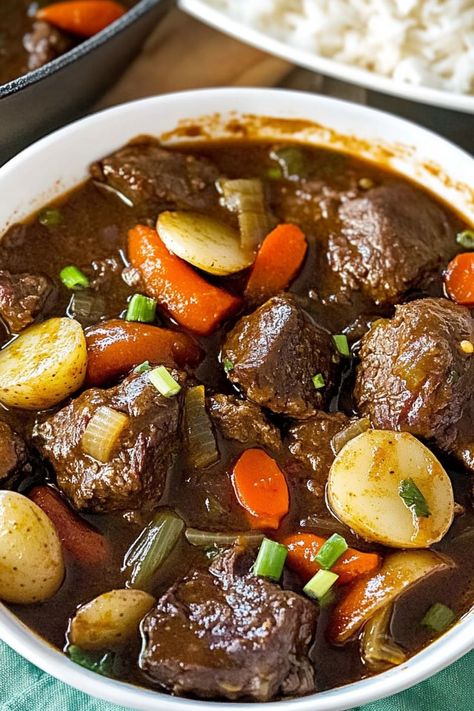 Jamaican Beef Stew is a traditional Caribbean dish featuring tender beef pieces simmered in a rich, flavorful broth. Jamaican Beef Curry Recipe, Jamaican Beef Stew Recipe, Brown Stew Beef, Jamaican Beef Stew, Jamaican Brown Stew, Stew Beef, Marinated Beef, Beef Stew Meat, Carrots And Potatoes