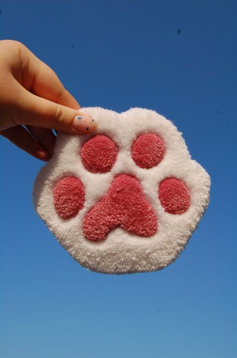 🐾 Discover Our Adorable Tufted Paw Coasters! 🐾

✨ Why You'll Love Them:
🌈 Unique and Handcrafted: Each coaster is lovingly hand-tufted, making it one-of-a-kind and adding a pop of personality to your space.

🌟 High-Quality Materials: Crafted with care using durable materials, these coasters are as practical as they are charming.

🎁 Great for Gifting: Surprise the animal lover Small Tufting Rugs Ideas, Tuft Coaster, Easy Tufting Ideas, Tufting Ideas Beginner, Punch Needle Rugs Ideas, Tufting Coaster, Tufted Coasters, Punch Needle Ideas, Tufted Coaster