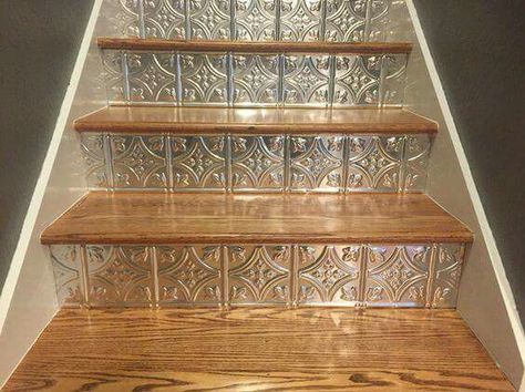 Faux tin ceiling tiles cut and used as stair risers! Reeonuh Marie on Pinterest. Stamped Tin Backsplash, Stairs With Glass, Vintage Tin Tiles, Decorative Ceiling Panels, Styrofoam Ceiling Tiles, Back Splashes, Metal Ceiling Tiles, Tin Ceilings, Faux Tin Ceiling