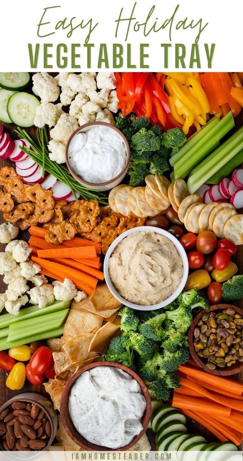 An overhead view of a vegetable tray with a variety of vegetables, crackers, nuts, and dips. Christmas Vegetables, Budget Clean Eating, New Years Appetizers, Crudite Platter, Vegetable Tray, Vegetable Platter, Appetizer Platters, Charcuterie Inspiration, Charcuterie Platter