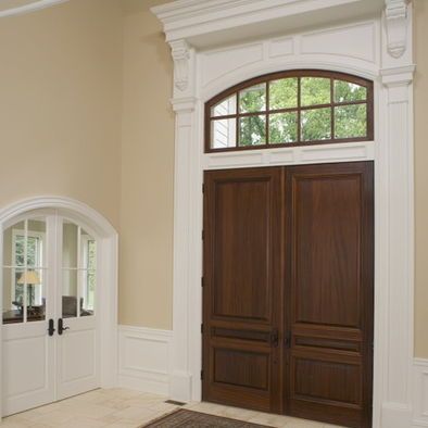 Trim Around Front Door, Front Door Trim Ideas Interior, Door Trim Ideas Interior, Wood Doors White Trim, Traditional Entryway Ideas, Arched Front Door, Traditional Entryway, Interior Front Door, Molding Ideas