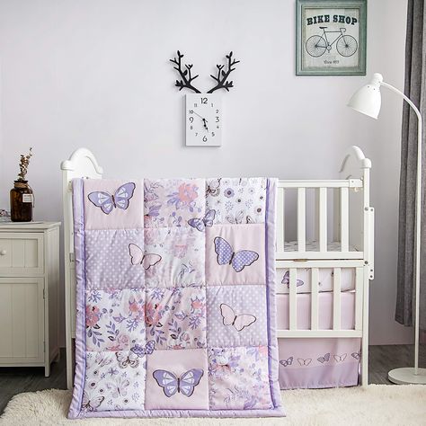 PRICES MAY VARY. Dimensions: This bed set includes a 28 x 52 inch fitted crib sheet with 8 inch deep pockets, a 32 x 42 inch quilted comforter, and a dust ruffle skirt that measures 27 x 51 inches with a 16 inch drop. Pastel Butterfly and Floral Collection: This 3-piece crib sheet set provides the perfect finishing touch for any baby girl nursery. It features pastel butterflies playing with watercolour flowers on the reversible patchwork quilt. Ultra-Soft Fitted Sheet: With the cute butterflies Purple Butterfly Nursery, Baby Girl Crib Bedding Sets, Butterfly Nursery Decor, Pastel Pink And Purple, Lilac Butterfly, Mini Crib Bedding, Quilted Comforter, Girl Crib Bedding Sets, Pastel Butterfly