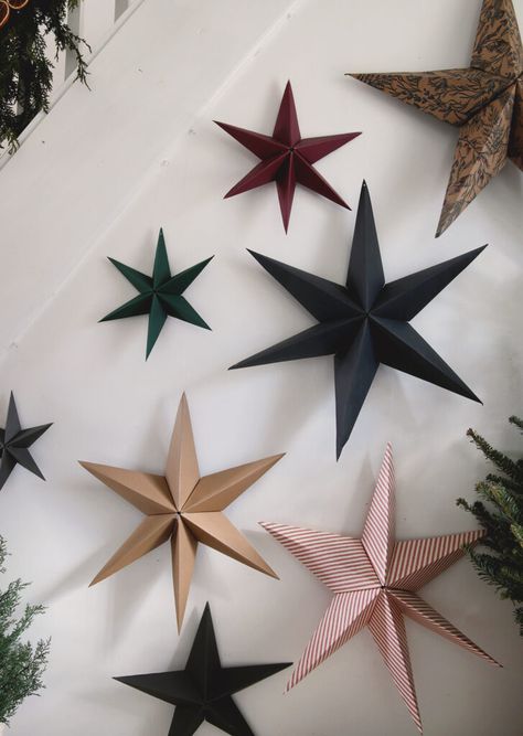 Learn how to make these easy 3D paper stars! Just a few supplies needed and you can have beautiful paper stars to decorate with in a few minutes! #diy #crafts #paperstars How To Make A 3d Star Out Of Paper, How To Make A 3d Paper Star, Paper 3d Stars Diy, Diy 3d Paper Star, Wrapping Paper Stars Diy, Making Paper Stars, Paper Star Diy Christmas, 3d Star Paper Craft, Christmas Stars Crafts