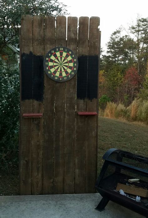 Out door dart board. Dart Board Outside, Outside Dart Board Ideas, Outdoor Dart Board Ideas, Dartboard Stand Diy, Outdoor Darts, Outdoor Dart Board, Dart Board Backboard, Bnb Ideas, Dart Board Wall