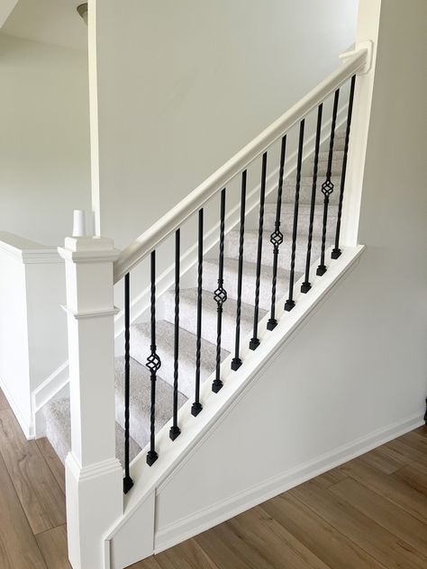 White Stair Railing With Wrought Iron, Stained Stair Railing, Stair Case Banister, Black And White Banister Stair Railing, Wrought Iron Balusters, White Railing With Black Spindles, White And Black Stair Railing, White Stairs Black Railing, White And Black Railing