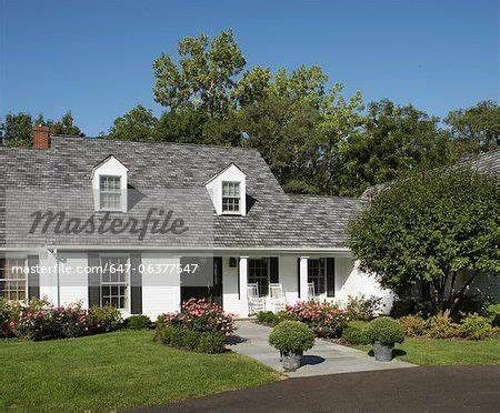 white cape cod style home with Tricorn Black Shutters, White Cape Cod Exterior, White House With Black Shutters, House With Black Shutters, Cape Cod Style Home, Cape Cod Exterior, White Wood Floors, Cape Cod Style House, Black Shutters