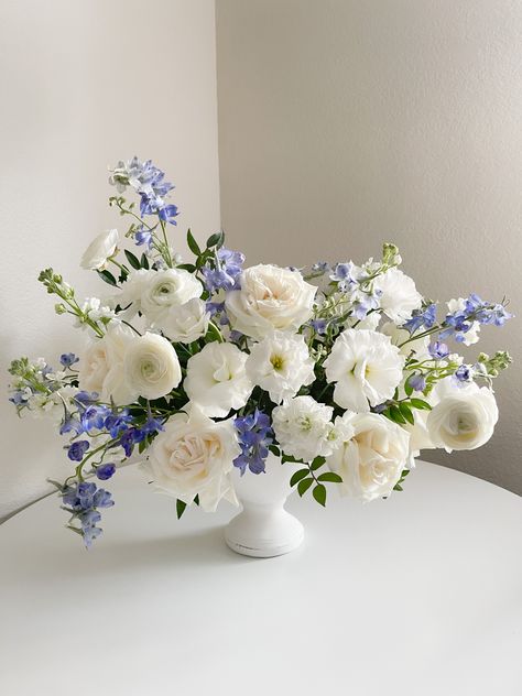 Large and abundant airy floral centerpieces @angelicalflowers Blue And White Faux Flowers, Low Lush Floral Arrangements, White Blue Floral Arrangement, Blue Delphinium Arrangement, Blue White Centerpieces, Coastal Wedding Centerpieces Round Table, Candlestick Floral Arrangement, White And Blue Wedding Centerpieces, Blue White Flower Arrangements