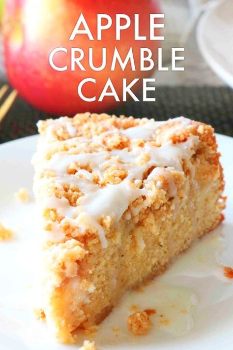 Apple Crumble Cake is fall cake recipe speckled with warm notes of cinnamon, cloves, and nutmeg. Topped off with a crunchy, buttery streusel and ends with a sweet vanilla glaze! Serve it as a little slice of breakfast heaven, a tea time snack, or the perfect addition to any fall dessert table. #applecake #applecrumblecake #cakerecipe #fallrecipes #falldesserts #dessert #cake #applerecipes #apples Apple Crumble Sponge Cake, Applecake Crumble, Fall Desserts Table, Easy Apple Crumble, Apple Crumble Cake, Kitchen Sanctuary, Fall Cake Recipes, Fresh Apple Cake, Fabulous Cakes