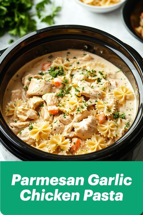 A cozy Crockpot Parmesan Garlic Chicken Pasta with tender chicken and farfalle pasta, coated in a creamy garlic-Parmesan sauce. The dish is topped with fresh parsley and includes hints of diced carrots for added color and flavor, making this meal as visually appealing as it is delicious. Perfect for busy weeknights! Parmesan Garlic Chicken Pasta, Crockpot Garlic Parmesan Chicken Pasta, Crockpot Garlic Parmesan Chicken, Parmesan Garlic Chicken, Garlic Parmesan Chicken Pasta, Parmesan Chicken Pasta, Garlic Chicken Pasta, Garlic Parmesan Pasta, Cozy Dinners