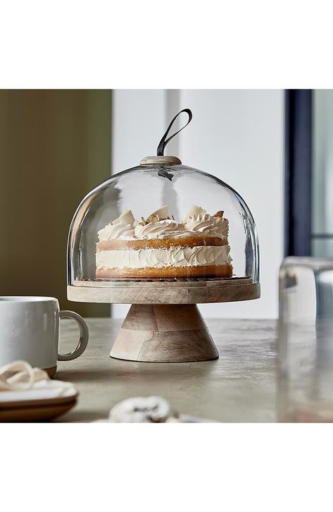 Show off your favorite baked treats in this mango wood cake stand that features a glass dome. 12 1/2" height Glass/mango wood Hand wash Imported Copper Cake Stand, Cake Dish Decor Ideas, Cake Stand With Cover, Unique Cake Stands, Dome Cake, Cupcake Factory, Cake Stand Ceramic, Creative Brands, Cake Stand With Dome