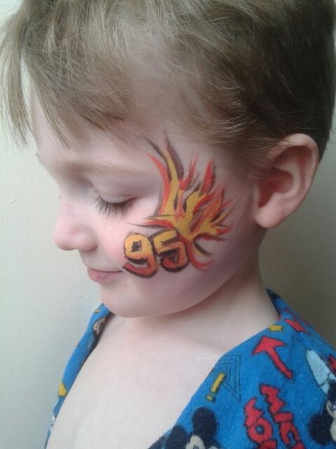 My son is a CARS fan so heres my take on the lightening mcqueen logo, whilst practising facepainting. Cars Face Paint, Car Face Paint, Schminke Halloween, Disney Face Painting, Face Paint Party, Thomas Party, Monster Truck Cars, Face Paints, Kids Face Paint