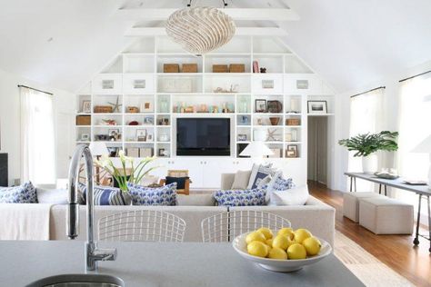 living room with vaulted ceiling and hanging lamp Modern Coastal Living Room, Beach Style Living Room, White Built Ins, Built In Shelves Living Room, Coastal Decorating Living Room, Living Room Built Ins, Diy Living Room Decor, Coastal Living Rooms, Entertainment Center Decor