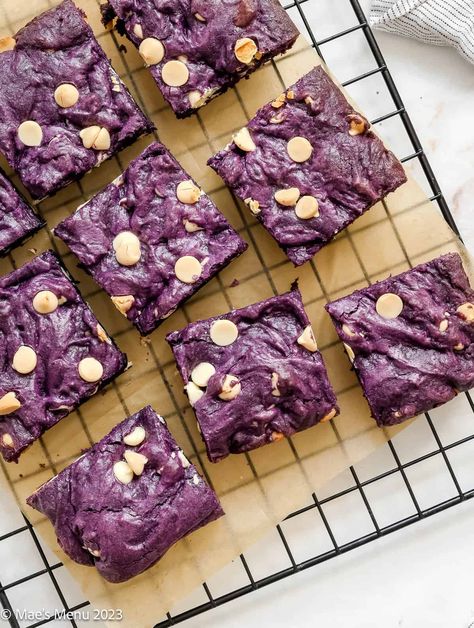 These showstopping Ube Brownies are deliciously fudgy and buttery! Made with vibrant ube extract and topped with sweet white chocolate chips, these will quickly become your favorite brownies. This easy-to-make, one-bowl recipe is the perfect indulgent treat that kids will love and the adults too! #ube #brownies #fudgybrownies #easysnacks #snacksforkids Ube Desserts Recipes Easy, Ube Brownies Recipe, Spooky Foods For Halloween, Ube Brownies, Halloween Treats Ideas, Ube Desserts, Ube Dessert Recipe, Ube Extract, Spooky Foods