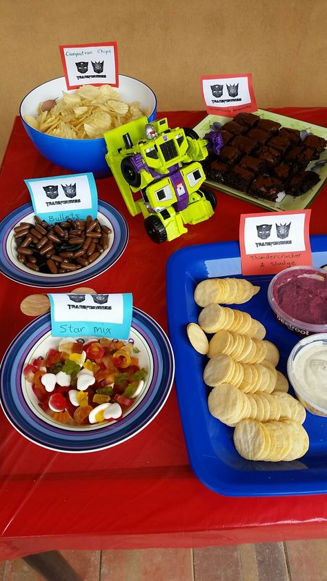 Transformer party food Transformers Movie Night, Transformers Birthday Food, Transformers Birthday Food Ideas, Transformers Party Food, Transformers Party Games, Transformer Birthday Party Ideas, Transformers Birthday Party Ideas, Transformer Birthday Party, Birthday Food Ideas