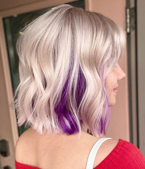 Platinum Lob with Purple Underneath Short Hair With Colour Underneath, White Hair With Dark Underneath, Blonde With Purple Highlights Short, Fall Fun Colors For Hair, Blonde Bob With Pink Peekaboo, Gray Hair Pink Highlights, Pink Peekaboo Hair Short, Platinum Blonde Hair With Purple Streaks, Blonde Hair With Pop Of Color Underneath