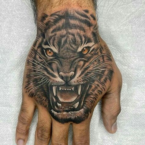 Tiger Tattoo On Hand For Men, Loin Hand Tattoo, Tiger Hand Tattoo Men, Panther Hand Tattoo, Hand Lion Tattoo, Tiger Tattoo Hand, Avicii Tattoo, Shoulder Cover Up Tattoos, Koi Fish Drawing Tattoo