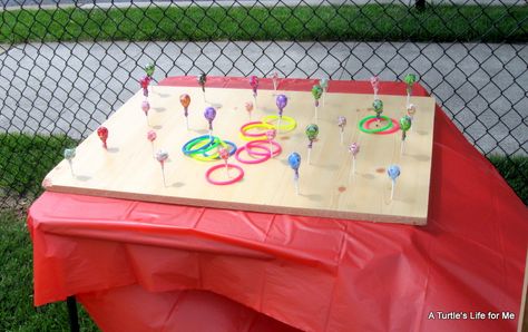 Ring toss w/ lollipops! Kid Friendly Halloween Party Games, Backyard Carnival Birthday Party, Diy Plinko, Kid Friendly Halloween Party, Plinko Board, Lollipop Ring, Tootsie Pops, Diy Carnival Games, Backyard Carnival