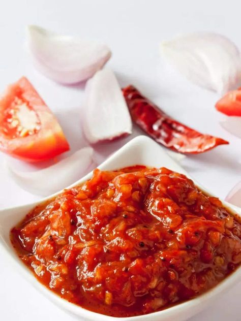 How to make viral Tomato Chutney at home | Times of India Dried Red Chili Peppers, Tomato Chutney Recipe, Peanut Chutney, Samosa Chaat, Schezwan Sauce, Garlic Chutney, Tamarind Chutney, Tomato Chutney, Chutney Recipe