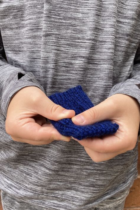 Learn or practice skills with this functional toy. Textured Marble Fidget Toy is a handheld toy using DK, worsted, or bulky weight yarn and a glass marble. Learn a tubular cast on, double knitting, and a tubular bind off in this functional toy! Students will work the toy from start to finish, creating a small keepsake packed with skills. This is a great way to use a bit of leftover yarn from a special project, and these toys make great gifts for kids and adults alike. #fidget #handmade Marble Fidget, Tubular Bind Off, Calm Nerves, Wrapped Lights, Seed Stitch, Toy Pattern, Bind Off, Dk Weight Yarn, Knit Picks