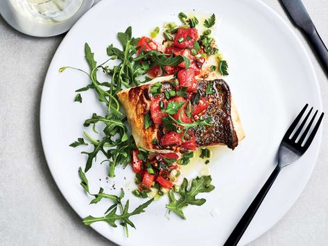 This Pan-Seared Bass with Garlic Scape Salmoriglio gets its flavor from an herbal, brightly acidic sauce. Get the recipe at Food & Wine. Pan Seared Sea Bass, Bass Recipes, Sea Bass Recipes, Farmers Market Recipes, Garlic Scapes, Paleo Meals, Italian Sauce, Wine Magazine, Summer Tomato