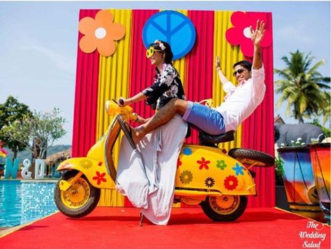 photo op with a colourful yellow scooter with flowers | Indian wedding photoshoot ideas | Indian wedding photo booth ideas | The wedding Salad | The ultimate guide for the Indian Bride to plan her dream wedding. Witty Vows shares things no one tells brides, covers real weddings, ideas, inspirations, design trends and the right vendors, candid photographers etc.| #bridsmaids #inspiration #IndianWedding | Curated by #WittyVows - Things no one tells Brides | www.wittyvows.com Haldi Kunku, Goa Wedding, Booth Wedding, Booth Decor, Indian Wedding Photos, Wedding Photo Booth, Chalkboard Wedding, Outdoor Wedding Decorations, Indian Wedding Decorations