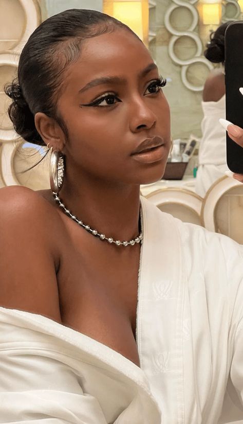 A slicked-back bun is a staple hairstyle, especially for those with curly and coily hair. Here's how to easily achieve the look inside. #slickhairstyles Cabello Afro Natural, Natural Hair Bun Styles, Justine Skye, Slicked Back Hair, Slick Hairstyles, Coily Hair, Slick Back, Hair Ponytail Styles, Sleek Hairstyles