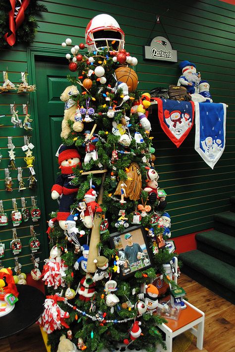 Sports themed Christmas tree at the Santa Claus Christmas Store. Christmas Sports Theme, Sport Christmas Tree, Sports Themed Christmas Tree Ideas, Football Themed Christmas Tree Ideas, Sports Theme Christmas Tree, Sports Tree Christmas, Sports Themed Christmas Tree, Sports Christmas Tree Ideas, Sport Themed Christmas Tree