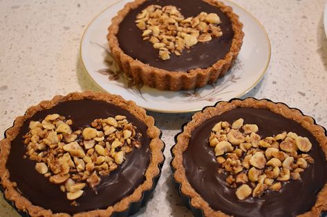 Nutella Mini Tarts with Candied Hazelnuts – Baker on the Run Nutella Ganache, White Chocolate Blondies, Mini Tarts, Ganache Filling, Mini Tart Pans, Tarts Crust, Mini Tart, Drop Cookies, Pie Tart