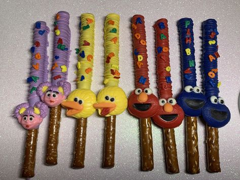 Sesame Street pretzel rods Elmo Pretzel Rods, Sesame Street Pretzels, Sesame Street Chocolate Strawberries, Sesame Street Chocolate Covered Pretzels, Sesame Street Strawberries, Sesame Street Favors, Sesame Street Pretzel Rods, Sesame Street Pinata, Elmo Treats