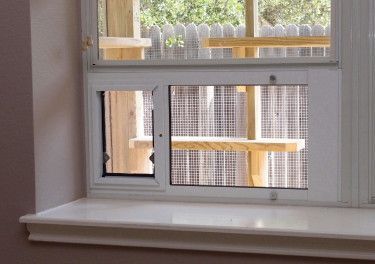 The Cat Carpenter Catios - There are several types and sizes of high quality window inserts that make it easy to add a cat door. Catio Window, Cat Door Diy, Catio Ideas, Cat Habitat, Cat Toilet Training, Cat Enclosures, Cat Fence, Cat Patio, Outdoor Cat Enclosure