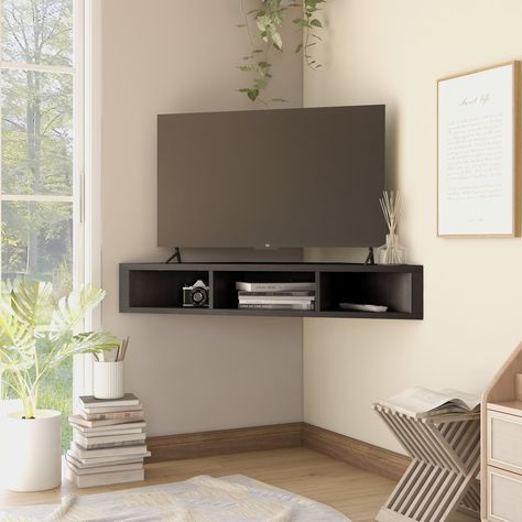 Space saving in more ways than one, this floating media console is a must-have for tight spaces. Mounted Corner Tv, Corner Tv Ideas, Corner Tv Wall Mount, Corner Tv Console, Corner Tv Unit, Corner Tv, Muebles Living, Corner Design, Tv In Bedroom