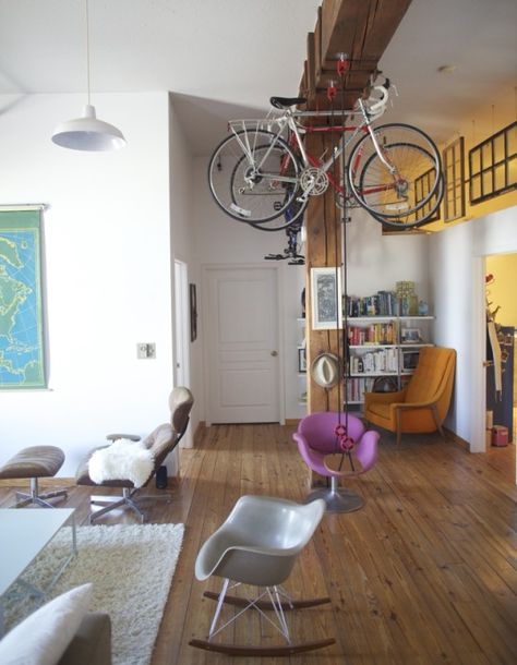 Overhead #bicycle storage that works on a pulley system. Plus an indoor swing? This might be the coolest NYC loft we've ever seen. via @Apartment Therapy Hanging Bike Rack, Bike Storage Apartment, Bike Storage Solutions, Nyc Loft, Indoor Swing, Bicycle Storage, Loft House, Bike Storage, Apartment Therapy