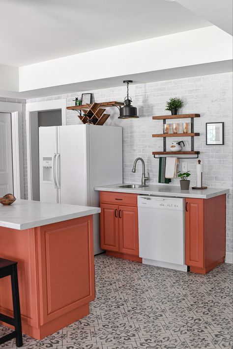 This kitchenette was built under $6000! Mediterranean style floor tile, terra cotta cabinets, white appliances and Formica countertop. Terra Cotta Color Kitchen Cabinets, Terracotta Color Kitchen Cabinets, Clay Colored Kitchen, Terra Cotta Cabinets Kitchen, Terra Cotta Kitchen Cabinets, Terracotta Cabinets, Terracotta Kitchen Cabinets, Terra Cotta Kitchen, Colored Kitchen Cabinets