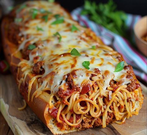 Introducing Spaghetti-Filled Garlic Bread: A tantalizing fusion of two beloved classics, this recipe takes the humble garlic bread to new heights by filling it with hearty spaghetti and gooey mozzarella cheese. With each bite, you’ll experience the perfect harmony of crunchy bread, savory spaghetti, and melty cheese, all enveloped in a fragrant blend of garlic, […] Garlic Bread Spaghetti, Spaghetti Bread, Crunchy Bread, Cheese All, Slow Cooked Chicken, Baked Garlic, Melty Cheese, Delish Recipes, Sauteed Vegetables