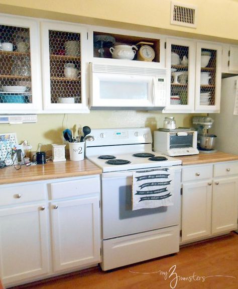 After: Chicken Wire Cabinet Facelift Cabinet Facelift, Painted Pantry Doors, Chicken Wire Cabinets, Cabinet Makeover Diy, Diy Kitchen Cabinets Makeover, Diy Kitchens, Kitchen Diy Makeover, New Kitchen Cabinets, Kitchen Cabinets Makeover