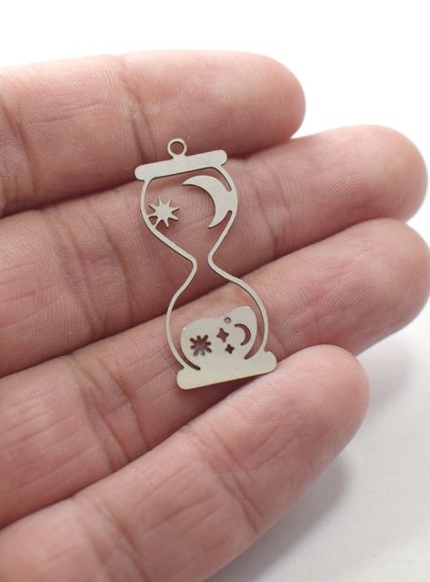 Laser-cut Stainless Steel Hourglass Charms & Earring Findings (0.6 x 13 x 33 mm) Laser Jewelry Design, Laser Cut Necklace, Laser Cut Wood Crafts, Laser Engraved Ideas, Jewelry Design Drawing, Laser Cut Jewelry, Jewelry Logo, Engraved Pendant, Laser Engraving Machine