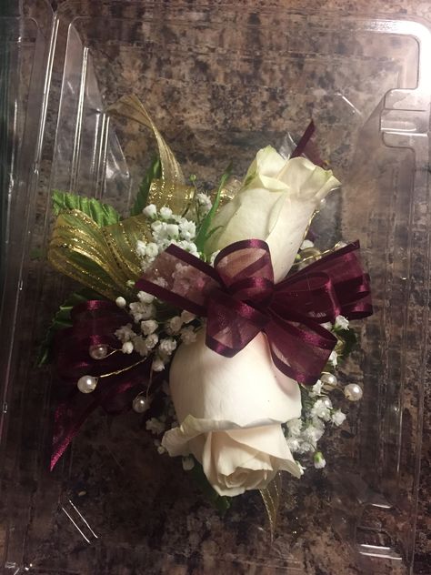 Maroon and Gold corsage Maroon Corsage And Boutonniere, Maroon And Gold Corsage, Maroon Corsage, Gold Corsage, Prom Planning, Prom Flowers Corsage, Prom Backdrops, Homecoming Flowers, Silver Wedding Decorations