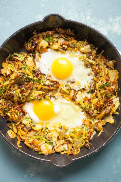 This simple Brussels Sprouts breakfast skillet has some amazing fall flavors and is my new favorite take on hash. I cook mine in a cast iron skillet with potatoes, bacon, and eggs! Dig in. | macheesmo.com #breakfast #skillet #easyrecipes #brusselssprouts Brussels Sprouts And Bacon, Sprouts And Bacon, Potatoes And Eggs, Sauteed Brussel Sprouts, Keto Egg Recipe, Breakfast Skillet Recipes, Fall Recipes Breakfast, High Fiber Breakfast, Breakfast Skillet