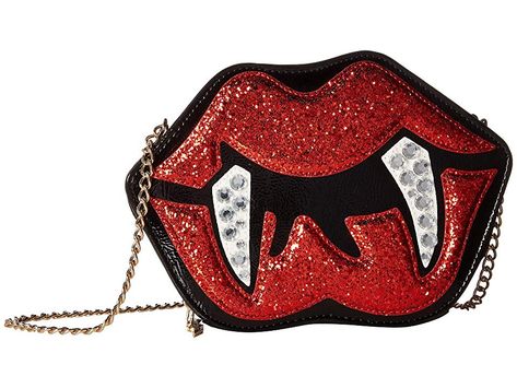 Betsey Johnson Glampire Crossbody (Red) Cross Body Handbags. Your look is fiercely tasty with the Betsey Johnson Glampire Crossbody bag. Made of polyurethane. Zipper closure. Chained crossbody strap. Signature logo hardware detail at back. Flat bottom. Lining made of polyester. Imported. Measurements: Bottom Width: 5 1 2 in Depth: 2 1 4 in Height: 6 1 4 in Strap Length: 54 1 2 in Strap Drop: 25 1 2 in Weight: 12.4 oz #BetseyJohnson #BagsandLuggage #Handbag #CrossBody #Red Betsey Johnson Purses, Cheap Purses, Betsey Johnson Handbags, Popular Handbags, Pu Leather Bag, Unique Purses, Handbags Affordable, Betsey Johnson Bags, Womens Purses