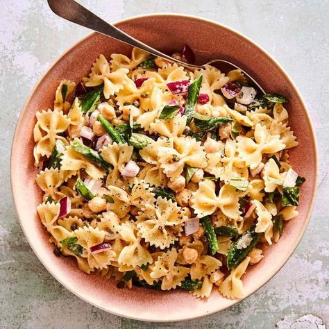 Whether you're in charge of bringing a small bite, a main dish, or a sweet ending, these easy potluck recipes will be the star of the spread. Our recipes include pasta salad, dips, sheet cake, hearty entrees, and other delicious, crowd-pleasing options. Pasta Salad With Chickpeas, Summer Picnic Recipes, Easy Potluck Recipes, Summer Pasta Salad Recipes, Salad With Chickpeas, Easy Potluck, Potluck Side Dishes, Picnic Recipes, Basil Recipes