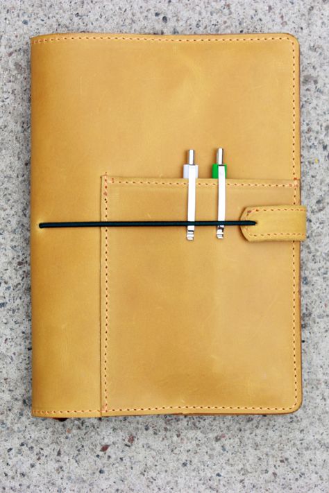 Personalized leather notebook cover with custom personalization. Handmade leather cover will protect your notebook, it will be securely protected from damage. No more bended pages and torn covers. I use standard international size as a reference. FEATURES - 1 pen holder pocket - 2 pockets to insert the notebook; - Elastic band closure. PERFECT FOR A5 notebook size. Size 5.83 x 8.27 inches notebook Personalized Leather Notebook, A5 Notebook Cover, Traveler Notebook, Leather Notebook Cover, Leather Diary, Leather Journal Cover, A5 Notebook, Journal Cover, Leather Notebook